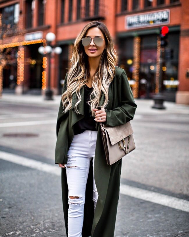 fashion blogger mia mia mine wearing an olive coat and white topshop jeans 