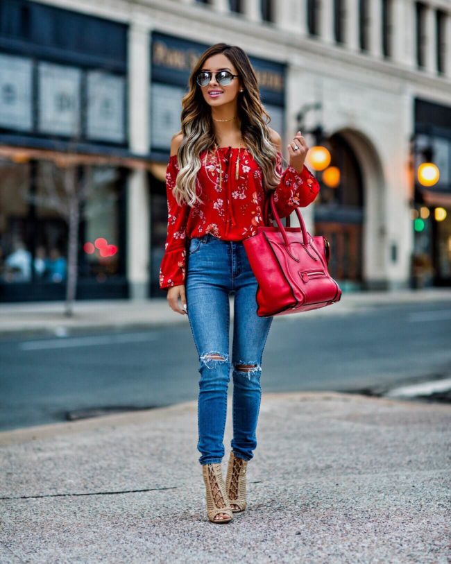 fashion blogger mia mia mine wearing a red off-the-shoulder top