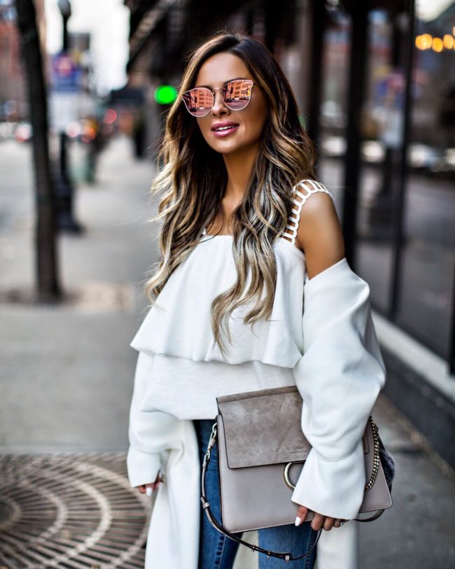 fashion blogger mia mia mine wearing a white cold shoulder top and pink sunglasses from nordstrom