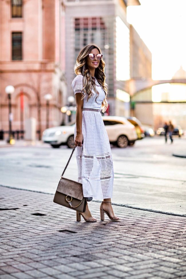 fashion blogger mia mia mine wearing a white eyelet dress from bebe and a chloe faye bag