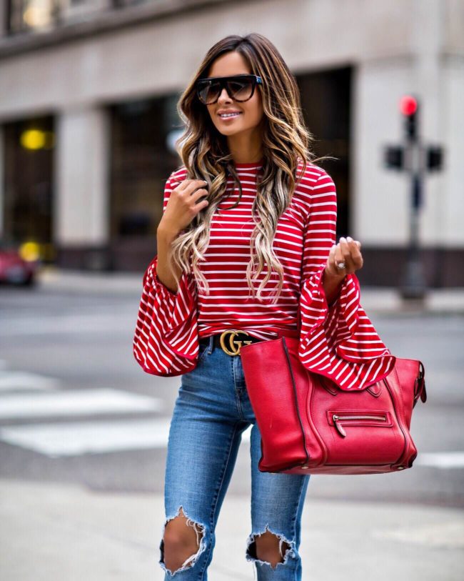 fashion blogger mia mia mine wearing a red striped top and a gucci belt