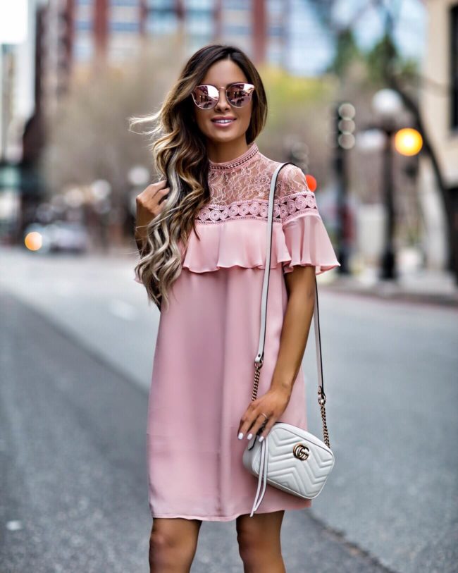 fashion blogger mia mia mine wearing a pink lace dress from express and pink quay sunglasses 