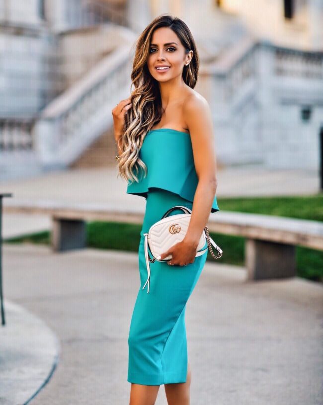 Fashion blogger mia mia mine wearing  a turquoise dress by likely from saks fifth avenue