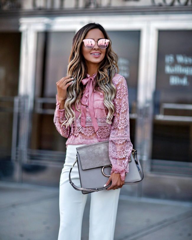 fashion blogger mia mia mine wearing a pink lace top from shopbop