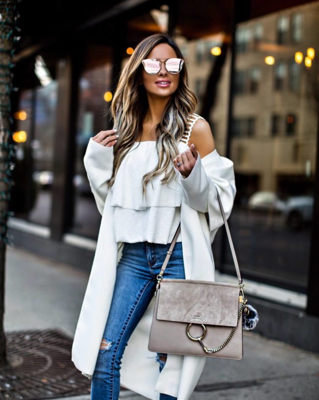 fashion blogger mia mia mine wearing a white top from nordstrom and a chloe faye bag