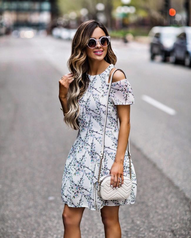 fashion blogger mia mia mine wearing a floral dress from revolve