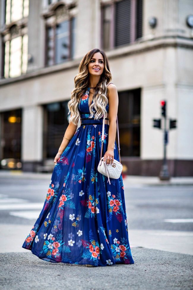 fashion blogger mia mia mine wearing a blue floral maxi dress from express for spring 