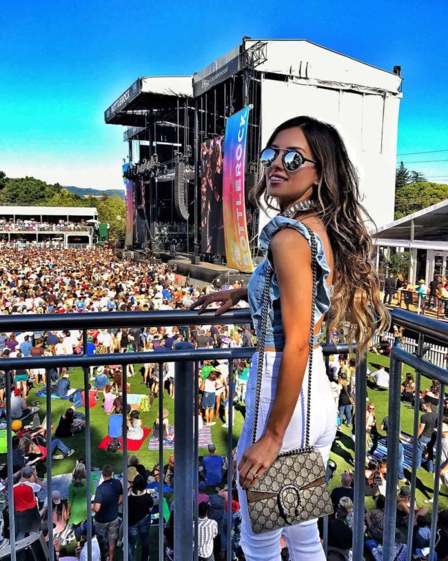 fashion blogger mia mia mine wearing a denim crop top from urban outfitters at bottlerock Napa
