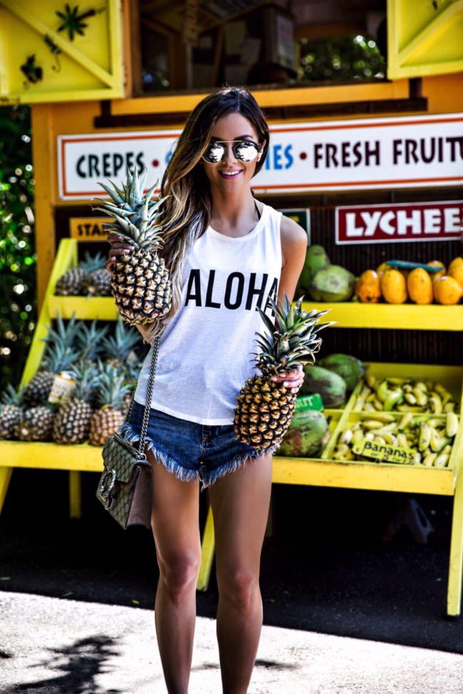 fashion blogger mia mia mine at the fairmont maui wearing an aloha top