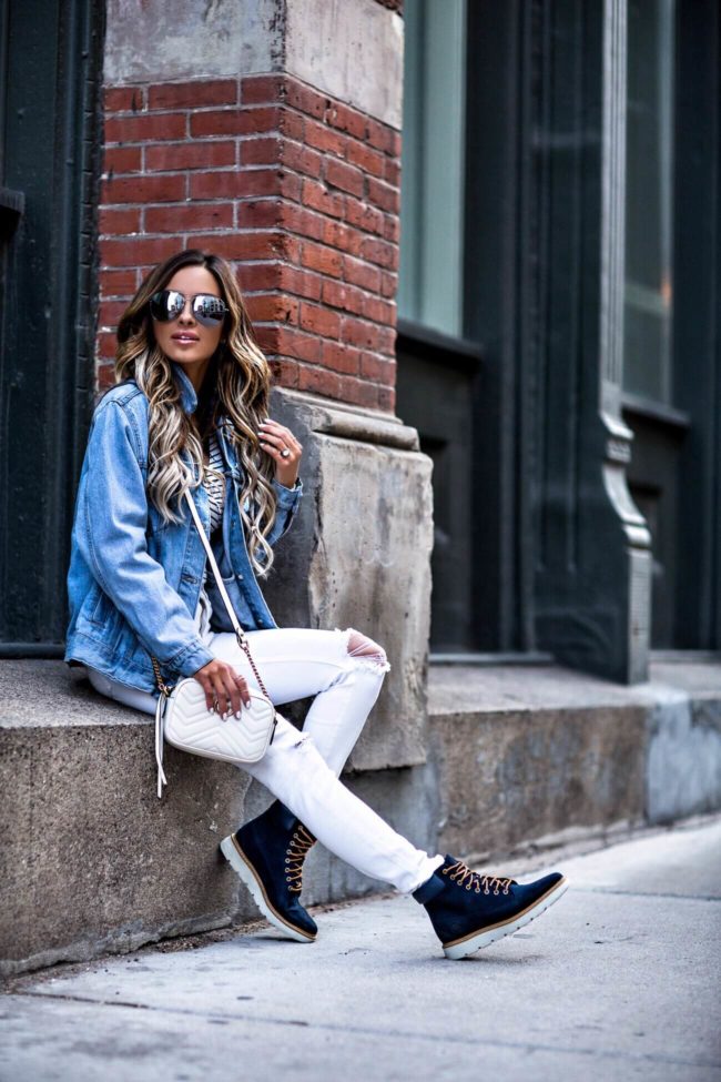 fashion blogger mia mia mine wearing timberland boots and white topshop jeans