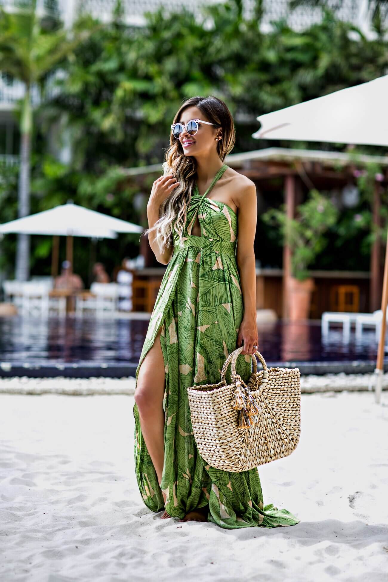 fashion blogger mia mia mine wearing a palm print dress at the modern hotel in honolulu hawaii
