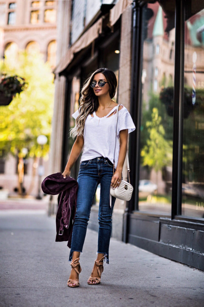 fashion blogger mia mia mine wearing a white lna tee and a gucci marmont white bag