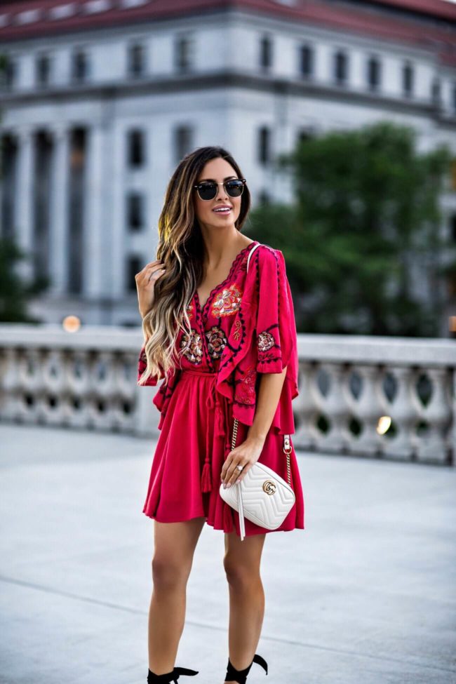 fashion blogger mia mia mine wearing a red free people dress and ray-ban clubmaster sunglasses