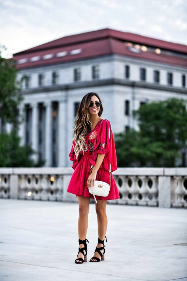 fashion blogger mia mia mine wearing a red embroidered free people dress from macy's and vince camuto lace-up heels