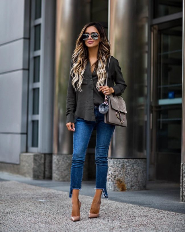 fashion blogger mia mia mine wearing an olive button down and step hem jeans by rag & bone