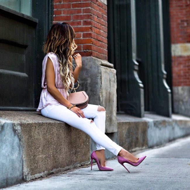 fashion blogger mia mia mine wearing a pink top and pink heels by christian louboutin