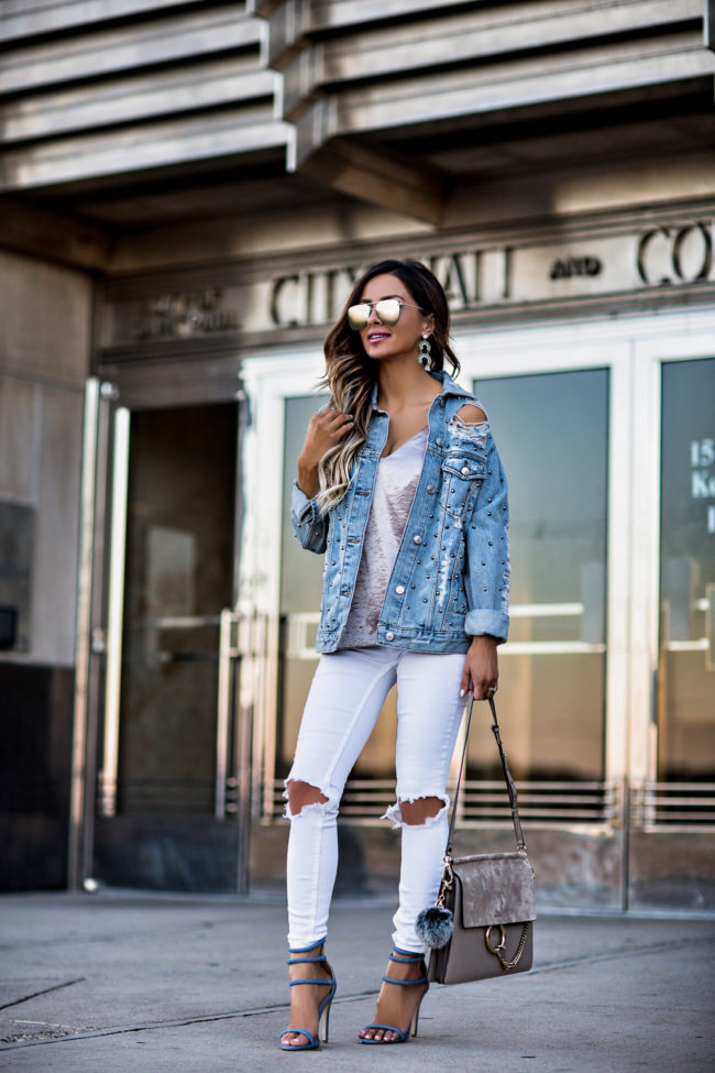 fashion blogger mia mia mine wearing a chloe faye medium bag and free people white jeans
