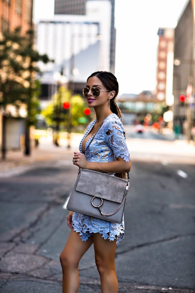 fashion blogger mia mia mine wearing a blue lace romper by missguided from nordstrom