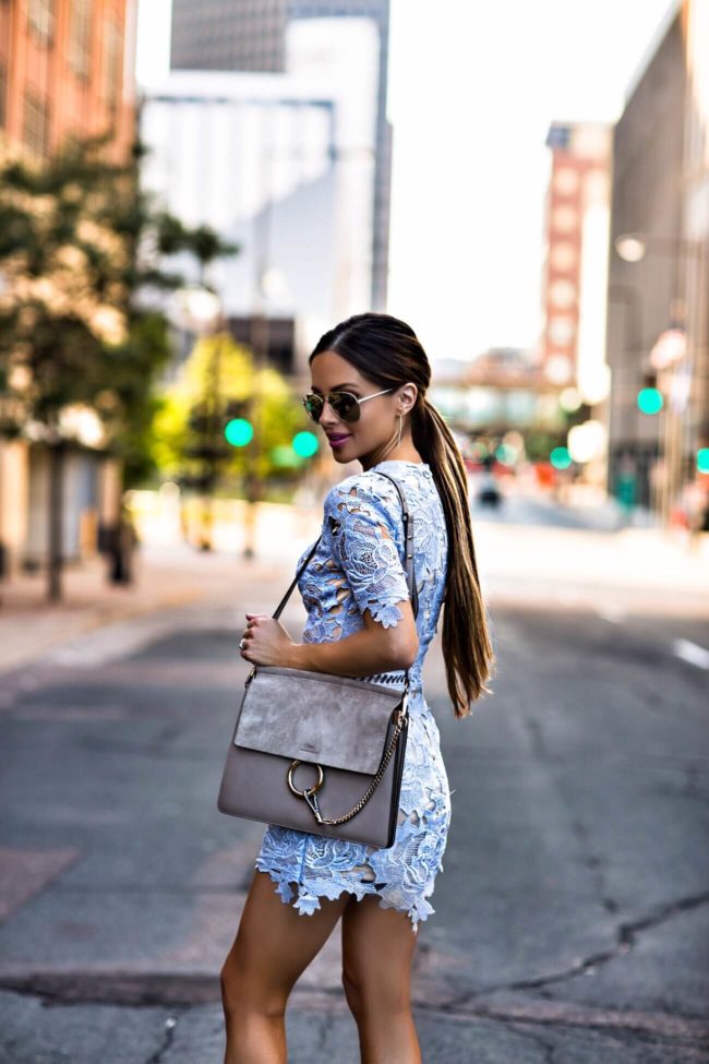 fashion blogger mia mia mine wearing a blue lace romper from nordstrom and le specs sunglasses from shopbop