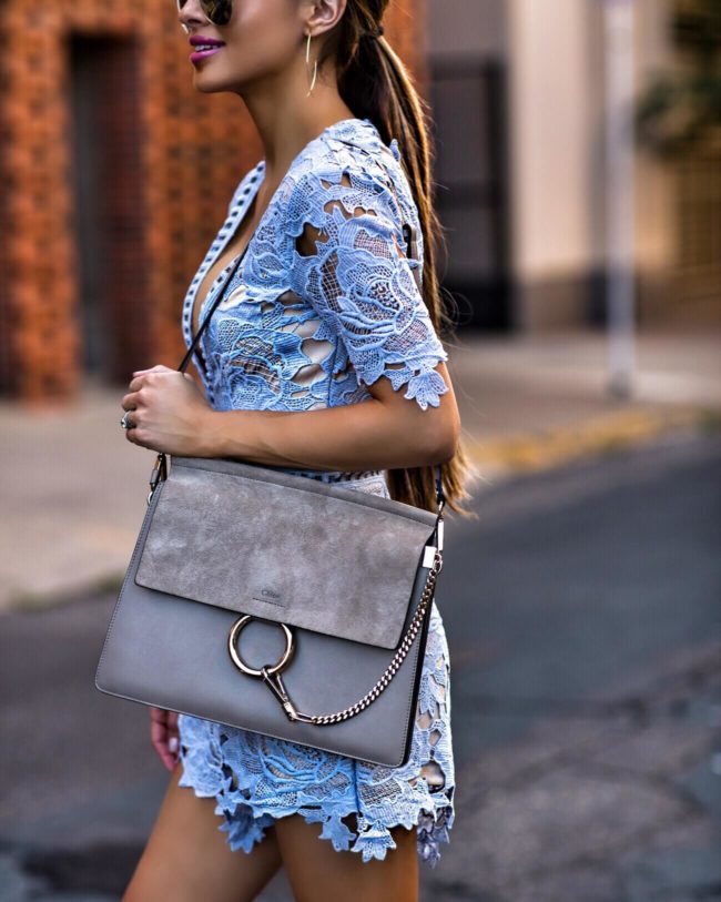 fashion blogger mia mia mine wearing a blue lace romper from nordstrom