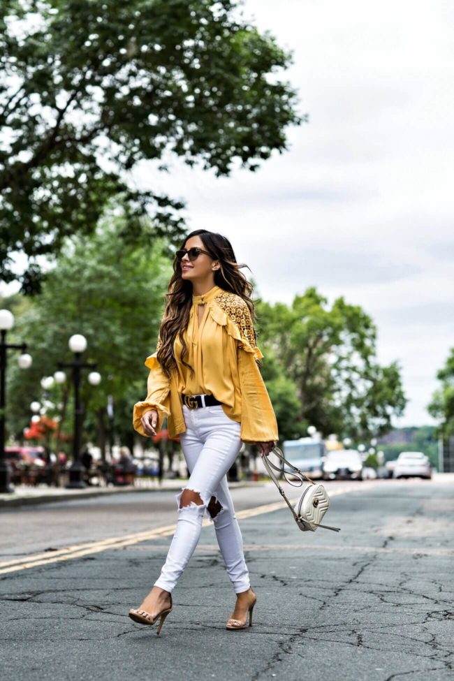 fashion blogger mia mia mine wearing a yellow free people top from macy's and a gucci marmont bag
