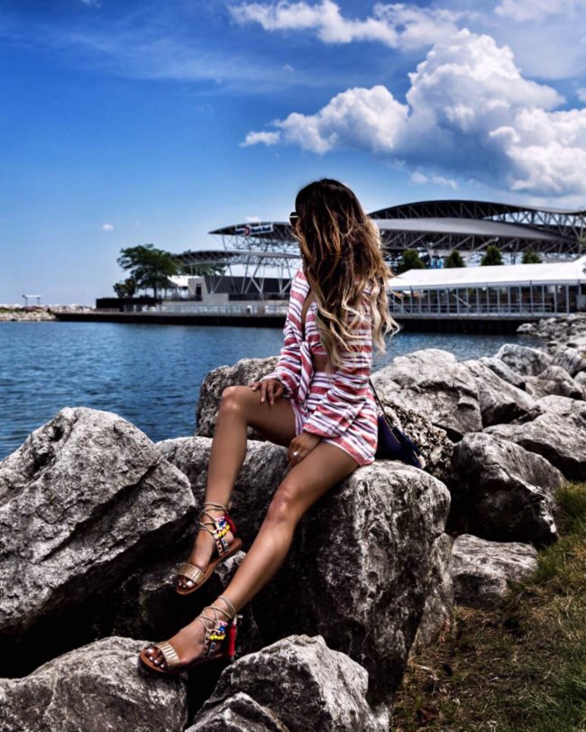 fashion blogger mia mia mine wearing a striped twinset from revolve at summerfest
