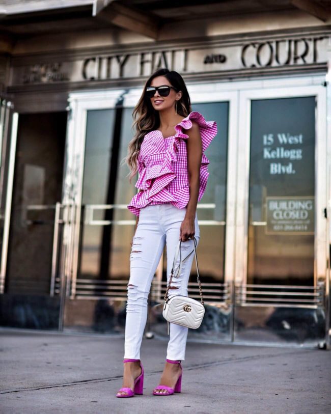 fashion blogger mia mia mine wearing a pink and white top from shopbop