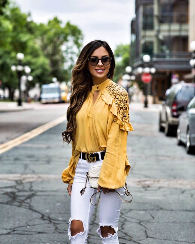 fashion blogger mia mia mine wearing a yellow crochet top from macy's