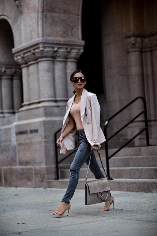 fashion blogger mia mia mine wearing a blush bardot blazer from revolve and gray blanknyc jeans