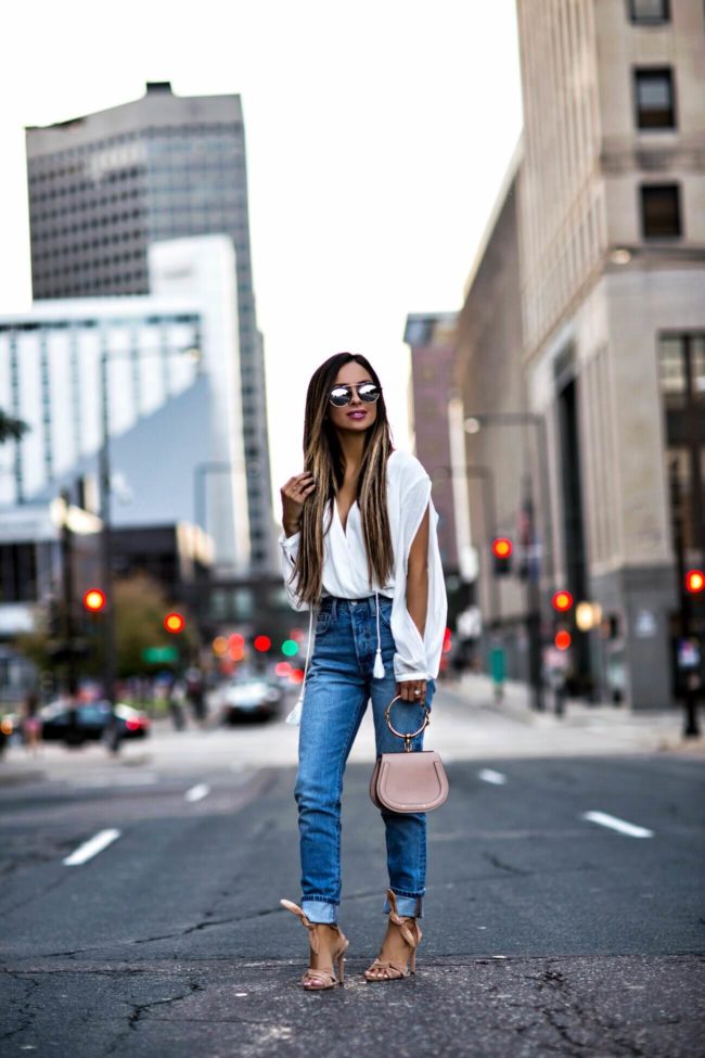 fashion blogger mia mia mine wearing illesteva sunglasses and levi's jeans from revolve
