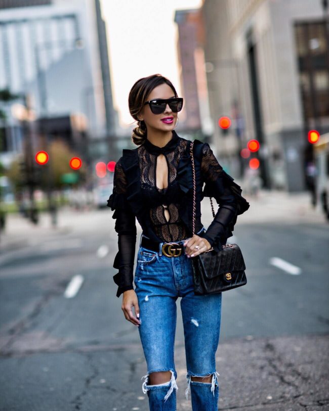 fashion blogger mia mia mine wearing a black lace bodysuit by love and lemons