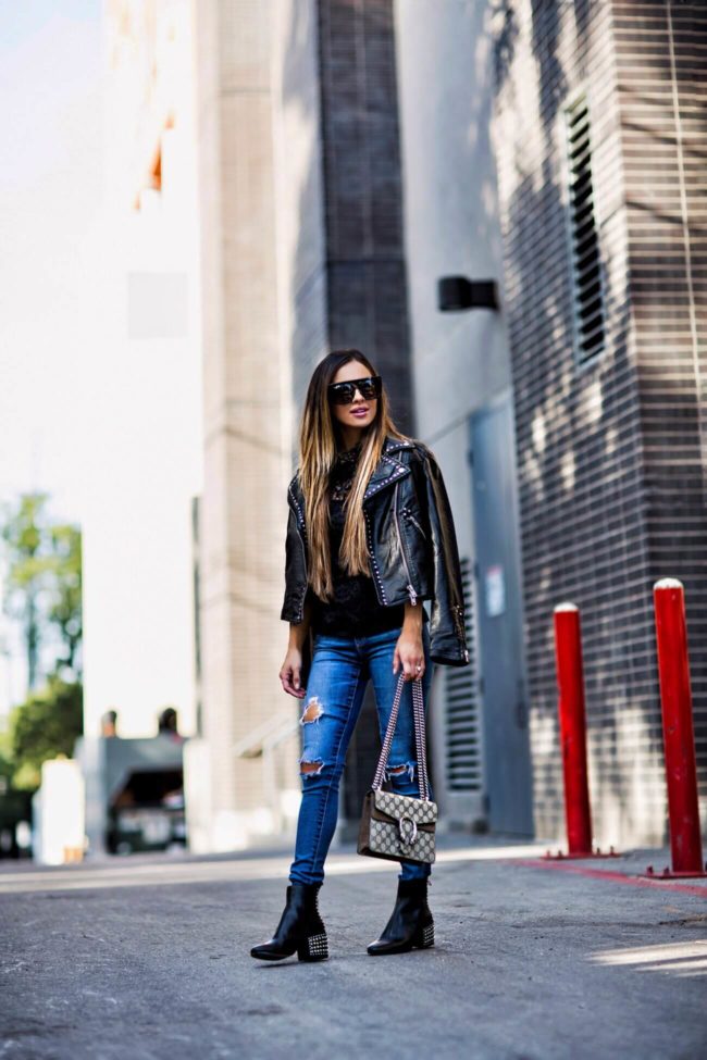 fashion blogger mia mia mine wearing a black faux leather jacket by free people from bloomingdale's