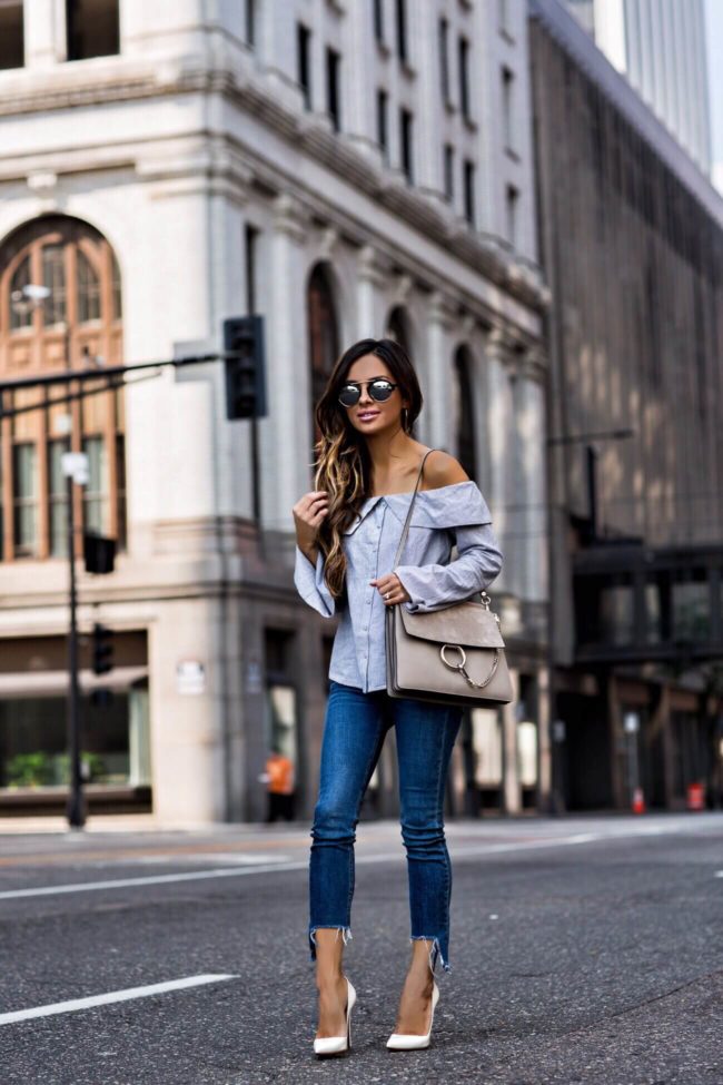 fashion blogger mia mia mine wearing a cropped denim by rag & bone and a chloe faye motty grey bag