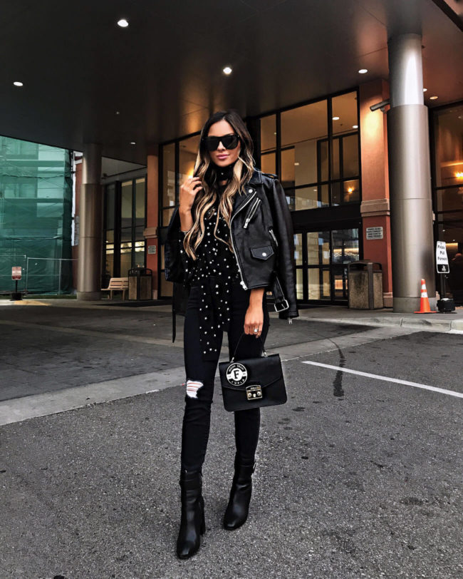 fashion blogger mia mia mine wearing a black star top from nordstrom