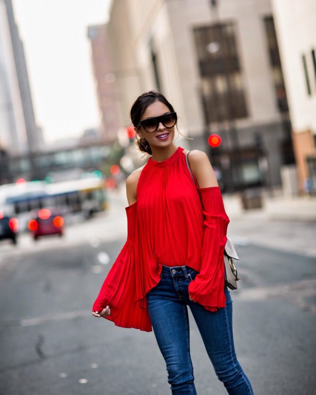 fashion blogger mia mia mine wearing a red top from shopbop