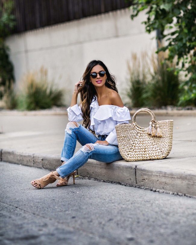 mia mia mine wearing a white off shoulder top and straw bag from shopbop