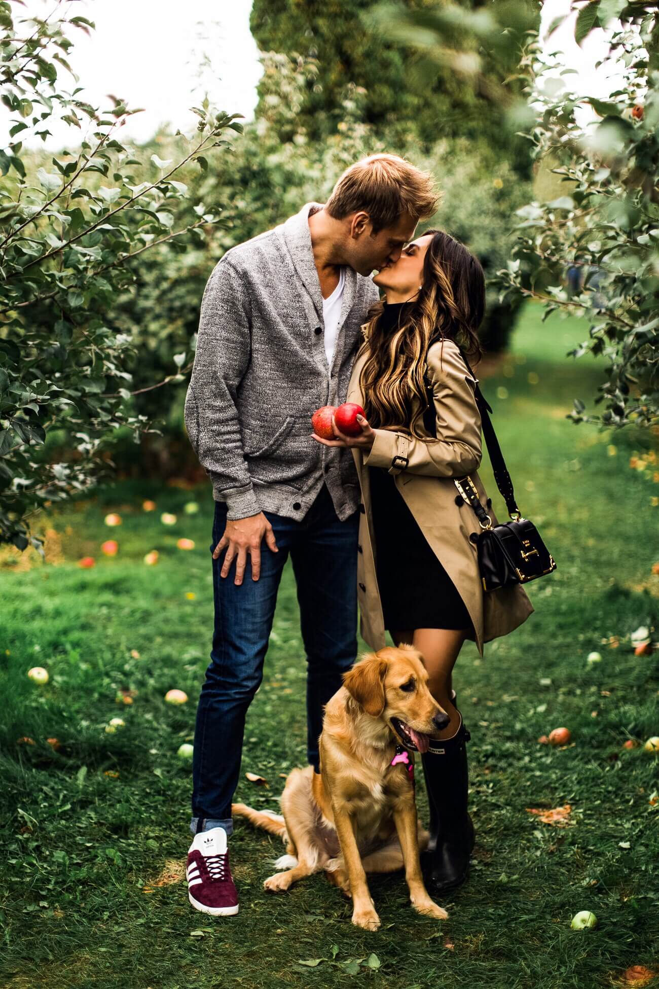 mia mia mine and husband phil thompson at an apple orchard with golden retriever