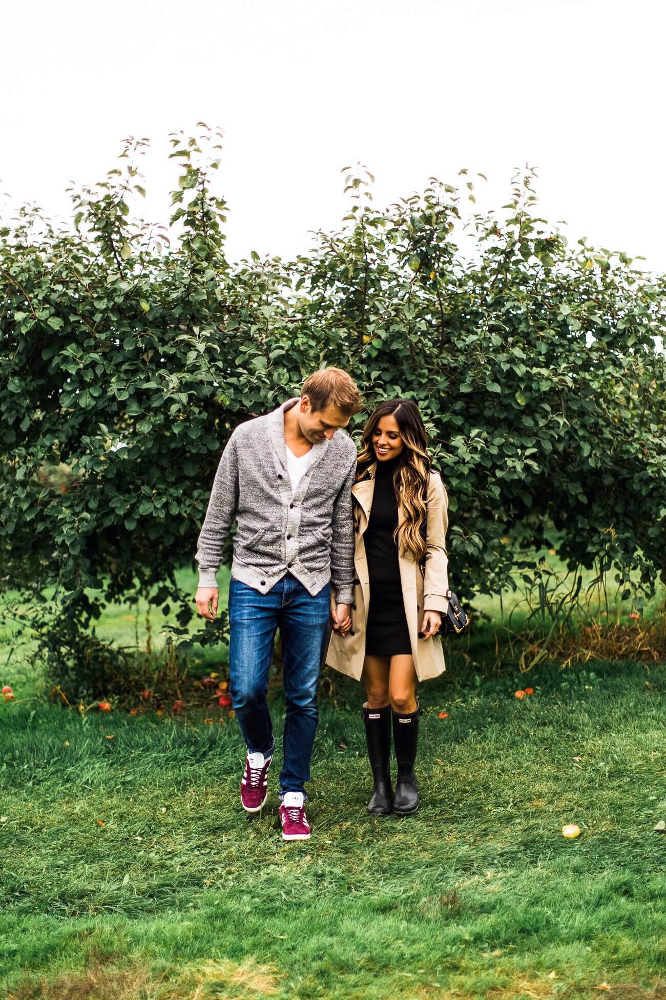 fashion blogger mia mia mine with husband at an apple orchard