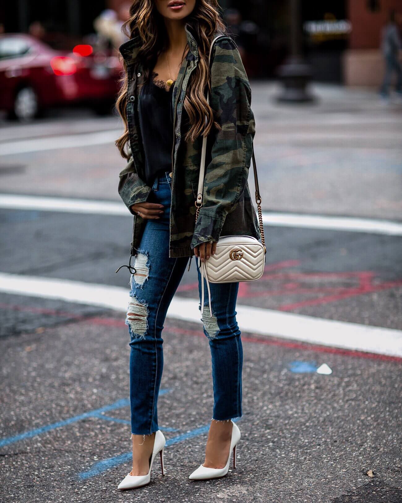 mia mia mine wearing distressed denim by l'agence and christian louboutin heels