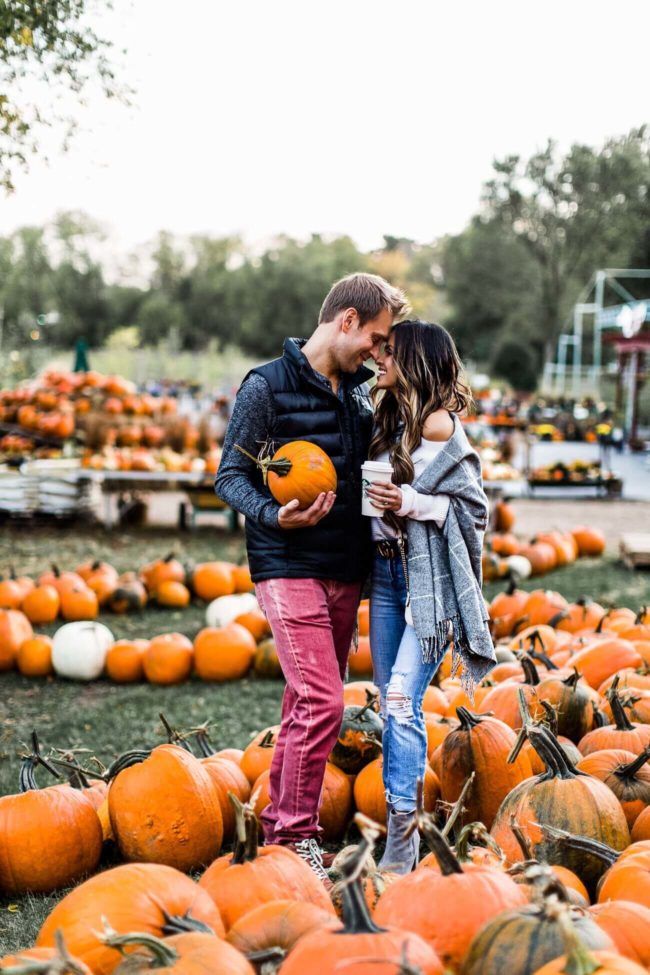 fashion blogger mia mia mine at a pumpkin patch with husband phil thompson