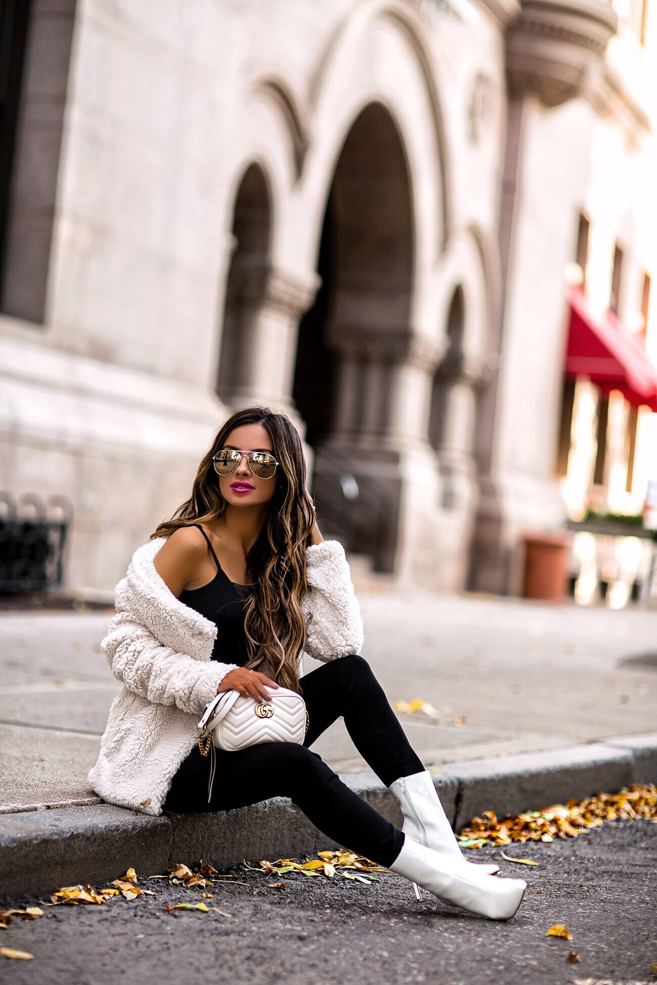 fashion blogger mia mia mine wearinga white gucci marmont bag and a white teddy bear coat from bloomindale's