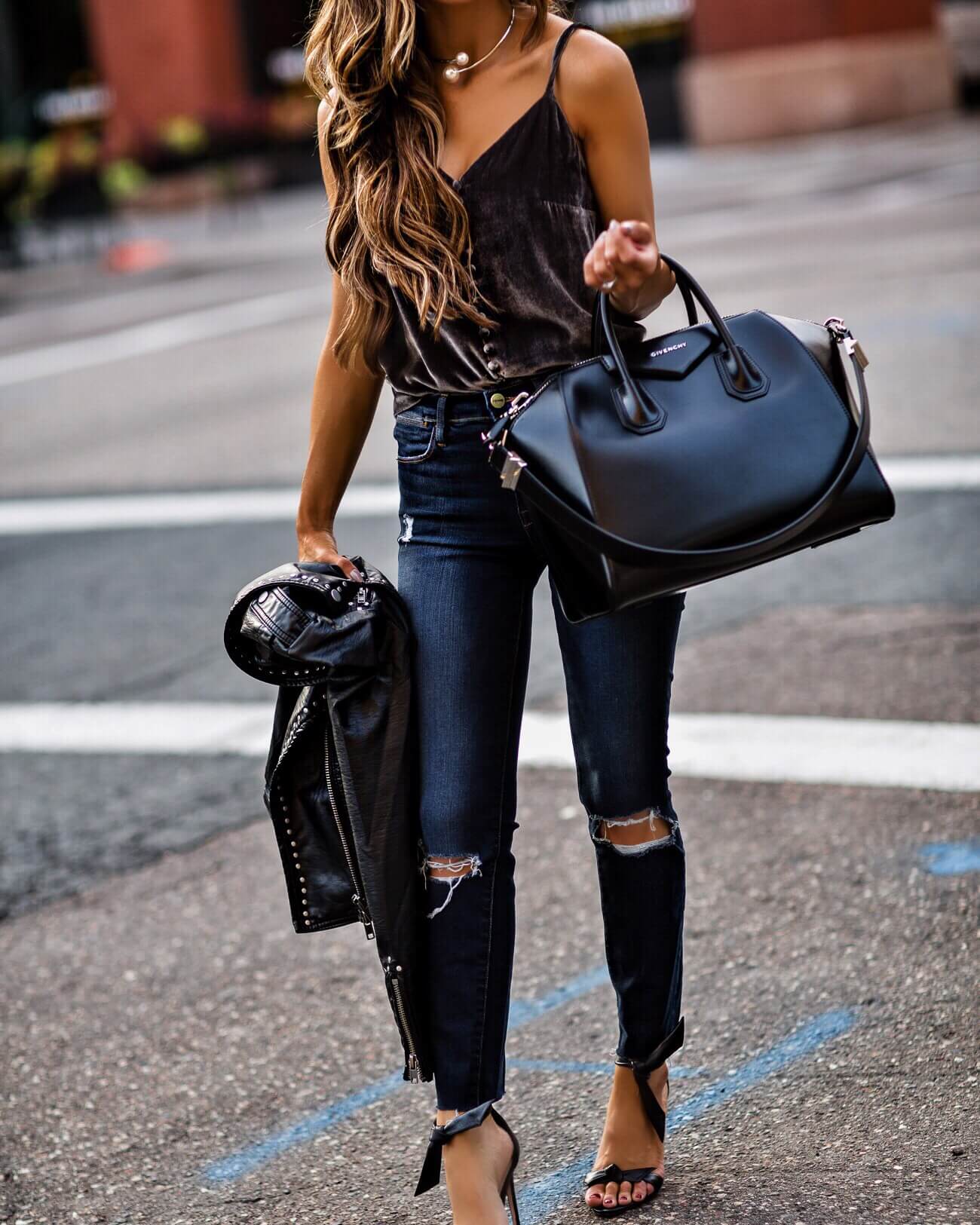 mia mia mine wearing a velvet cami and leather givenchy bag