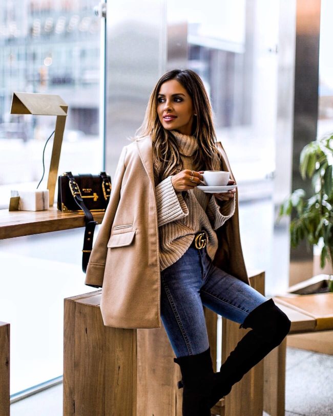 mia mia mine wearing a camel coat drinking coffee on cyber monday