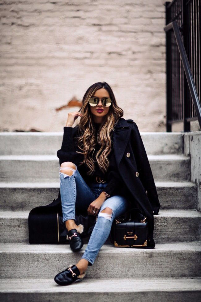 fashion blogger mia mia mine wearing a prada cahier bag and calvin klein coat