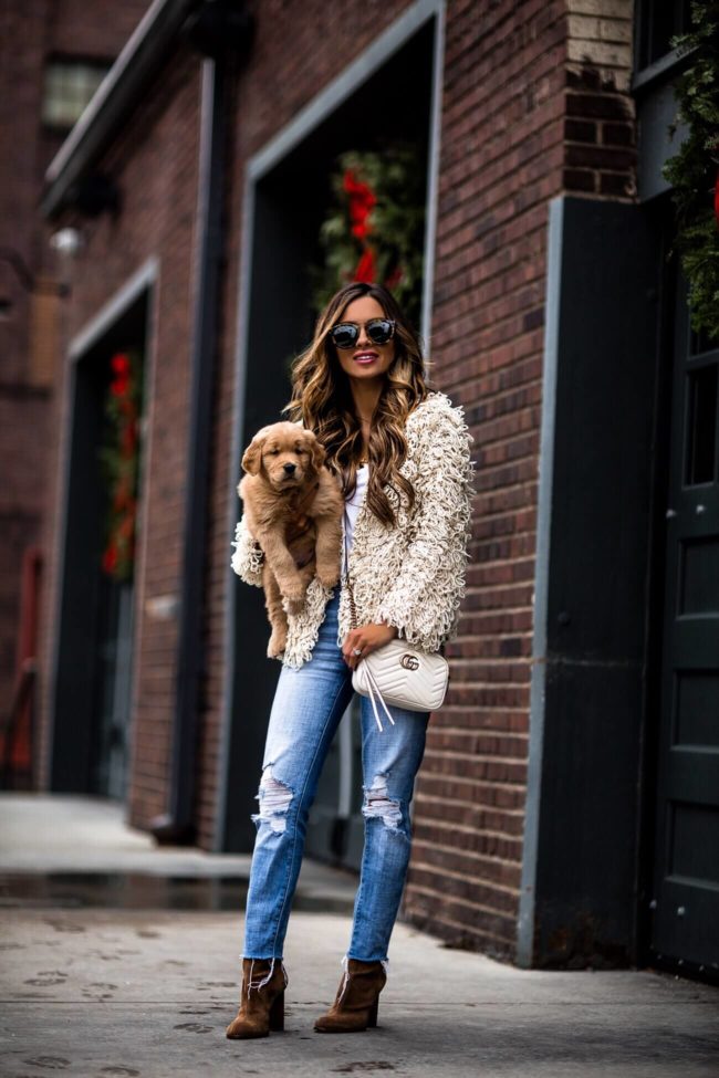 fashion blogger mia mia mine wearing a shag jacket with puppy leo