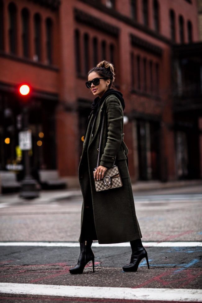 fashion blogger mia mia mine wearing a gucci dionysus bag and black jimmy choo booties