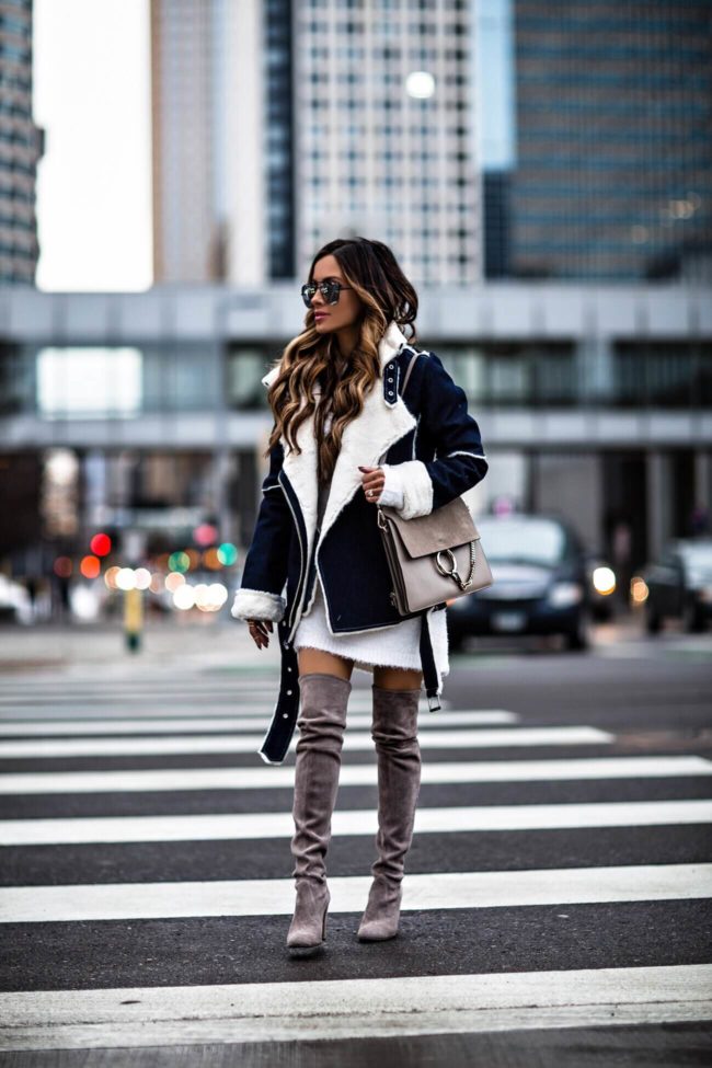 fashion blogger mia mia mine wearing a joa denim jacket and stuart weitzman over-the-knee boots from nordstrom