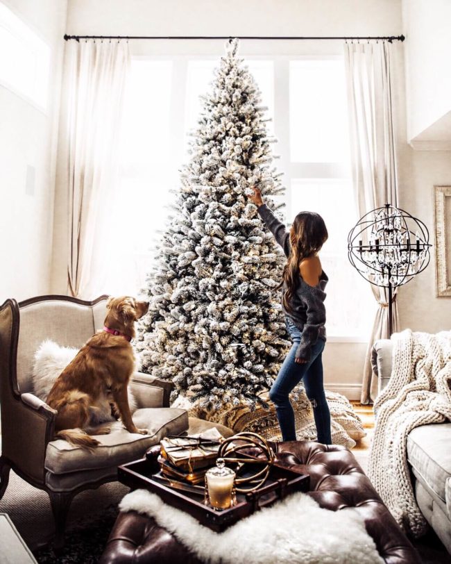 mia mia mine decorating christmas tree with puppy