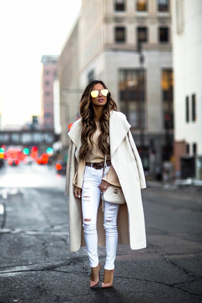fashion blogger mia mia mine wearing a cream waterfall jacket and white ripped frame denim