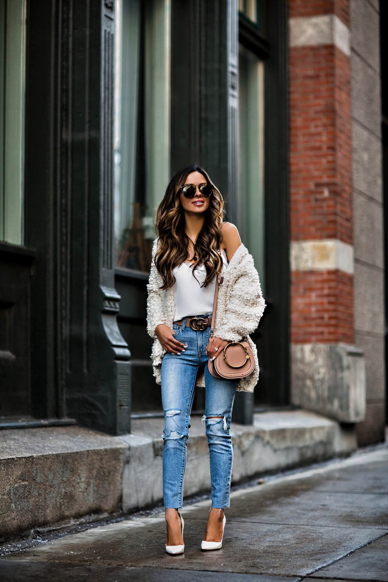 fashion blogger mia mia mine wearing a white cardigan from shopbop and a gucci belt